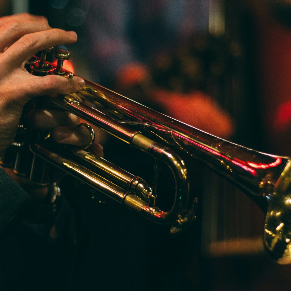 Close up of a hand playing trombone